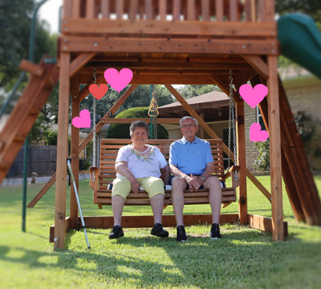 sweetheart swing with grandparents on backyard swing set on the adult porch swing